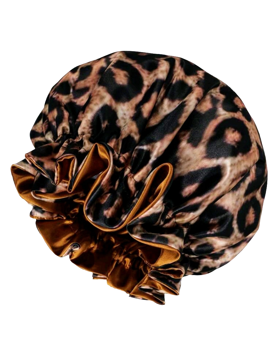 A leopard print reversible satin sleeping hair bonnet.