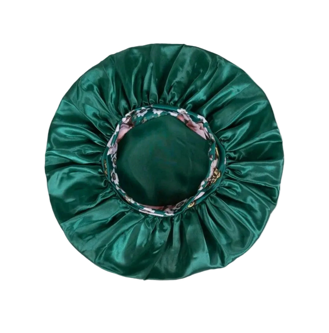 Green satin bonnet with floral rim on a white background