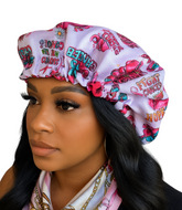 Woman wearing a colorful headscarf with motivational phrases on a white background