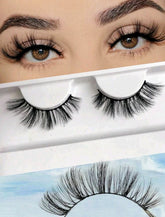 A pair of natural false eyelashes displayed above its packaging, with the packaging showing a model wearing the eyelashes.