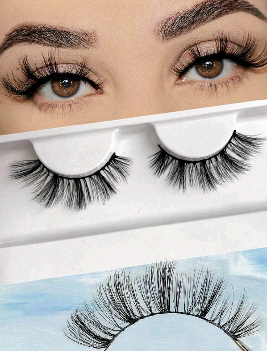 A pair of natural false eyelashes displayed above its packaging, with the packaging showing a model wearing the eyelashes.