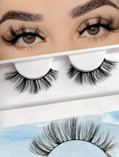 A pair of natural false eyelashes displayed above its packaging, with the packaging showing a model wearing the eyelashes.