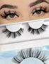 A pair of natural false eyelashes displayed above its packaging, with the packaging showing a model wearing the eyelashes.