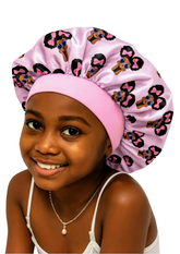 Child wearing a pink satin bonnet with afro girl print on a white background