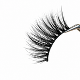 Pair of false eyelashes on a white background