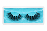 A pair of black false eyelashes in a clear plastic clamshell package with a bright turquoise blue insert, shown against a plain white background.