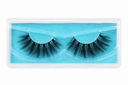 A pair of black false eyelashes in a clear plastic clamshell package with a bright turquoise blue insert, shown against a plain white background.