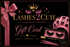A black gift card design for Lashes2Cute with a large pink satin ribbon on the left, gold and pink typography, a crown graphic, and beauty-themed product imagery including false eyelashes, a pink satin bonnet, and a pink tube on a black background.