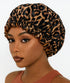 Leopard print satin bonnet worn by a model on a white background