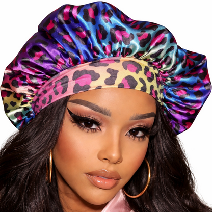 Woman wearing a colorful leopard print satin bonnet on a white background