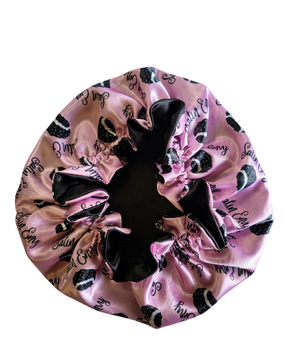 Pink satin hair bonnet with black bonnet design and &