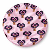 Pink satin pillow with cartoon characters pattern on a white background