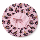 Pink shower cap with afro girl pattern on a white background