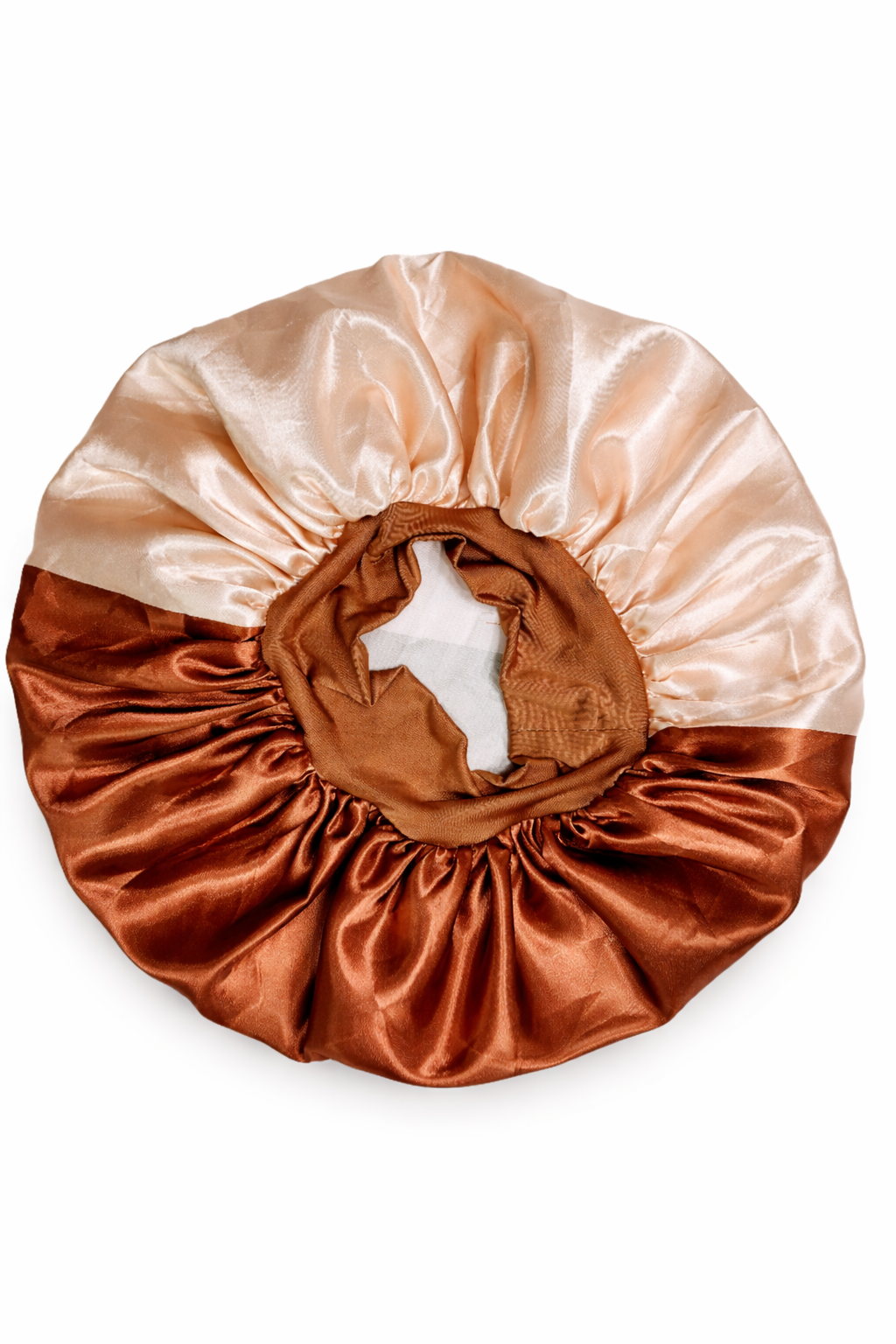 Two-toned satin hair bonnet in peach and brown on a white background