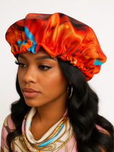 Woman wearing a colorful satin headband with a plain background