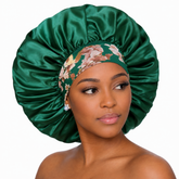 Woman wearing a green satin bonnet with floral headband on a white background